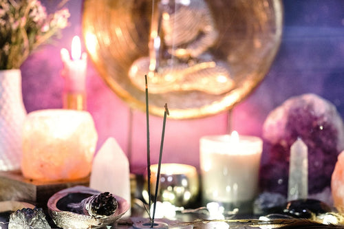 Sage stick smudging ritual with sacred smoke used for energy clearing, crystal cleansing, and space purification