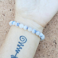 Blue Dumortierite stone bracelet on wrist promoting calm focus and communication.