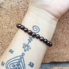 Handmade Garnet bracelet with natural gemstones and strong energy.