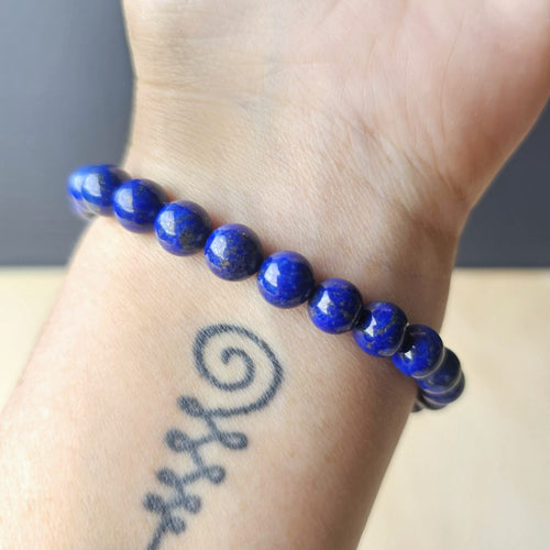 Lapis Lazuli bracelet with pyrite inclusions, promoting communication and insight.
