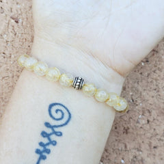 Natural gemstone beaded bracelet radiating energy and divine connection.