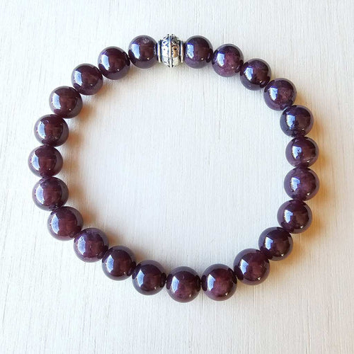 Deep red gemstone bracelet for grounding, vitality, and focus.