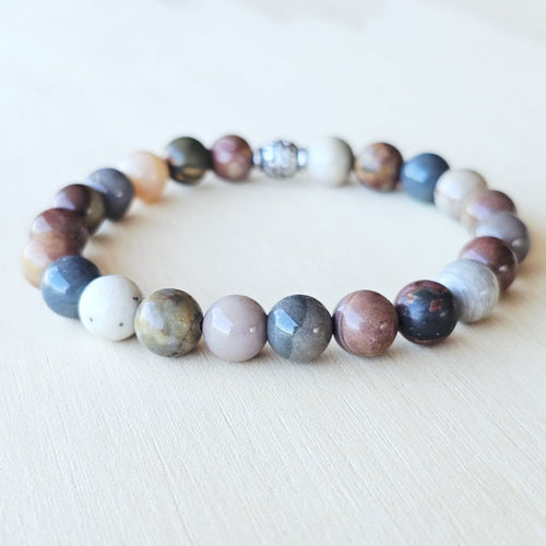 Handmade Petrified Wood crystal bracelet for grounding and transformation.