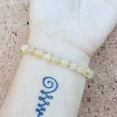 Handmade Rutilated Quartz crystal bracelet for clarity and grounding.