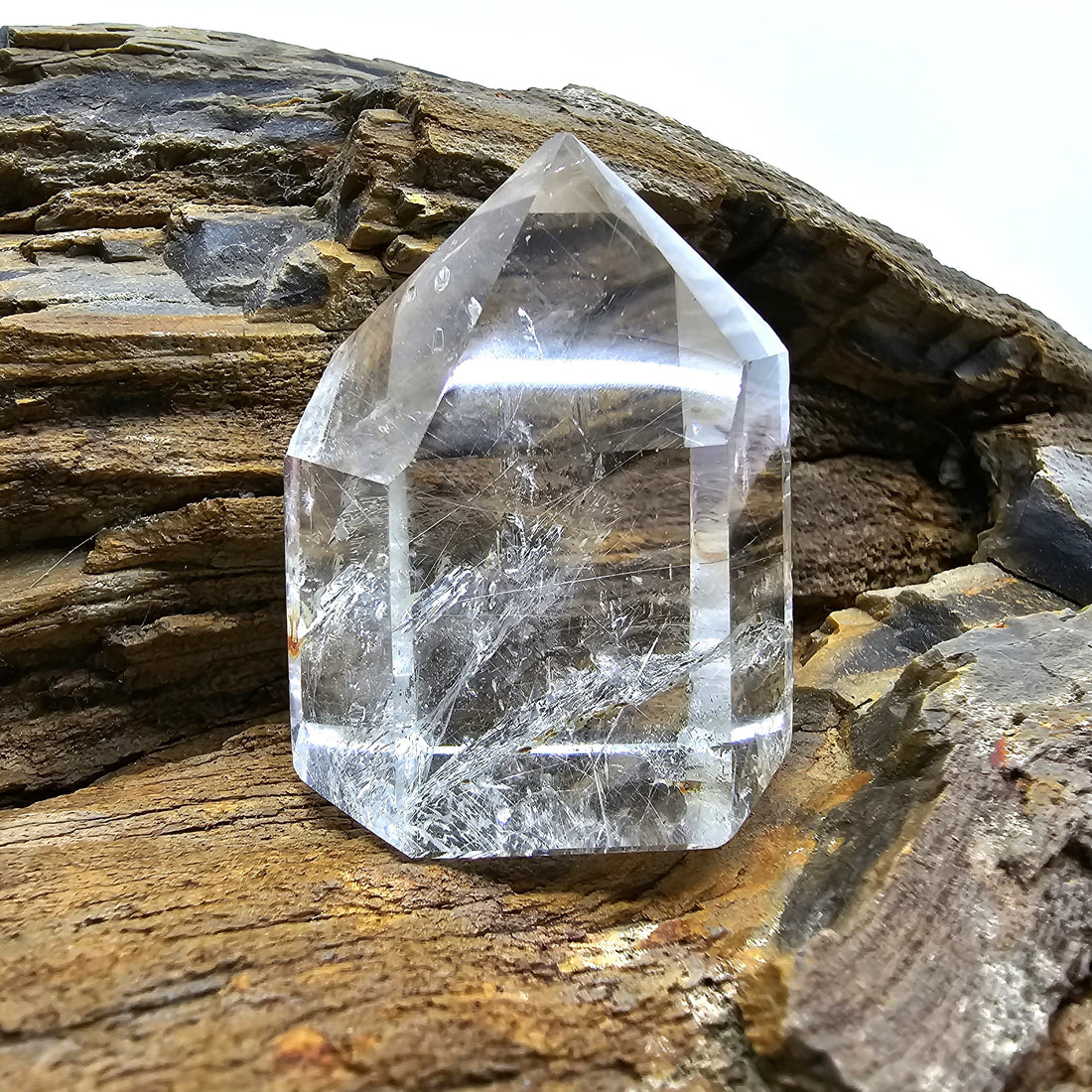 Silver Rutilated Quartz Silver Rutilated Quartz On Wooden Table