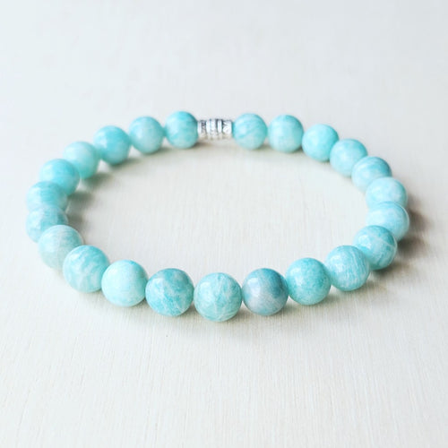 Amazonite gemstone bracelet featuring natural bead variations, designed to open the heart and throat chakras.