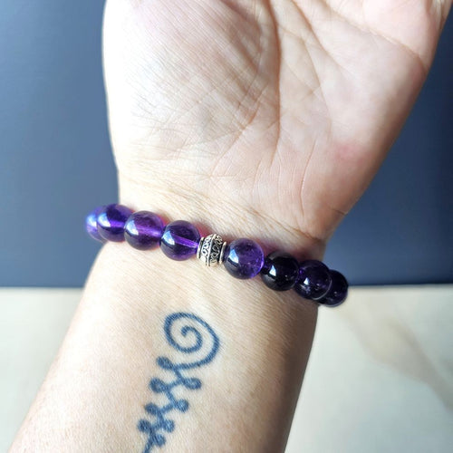Amethyst Pixiu bracelet on arm, handmade with intention for calm focus and protection