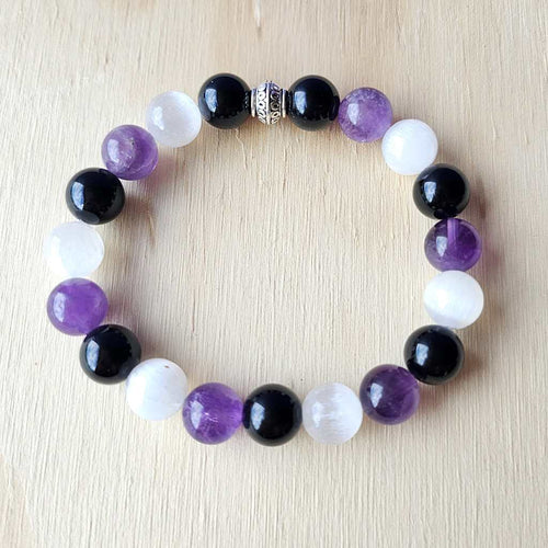 Authentic Amethyst, Selenite & Smoky Quartz gemstone bracelet with 10 mm beads, symbolising calm and clarity.