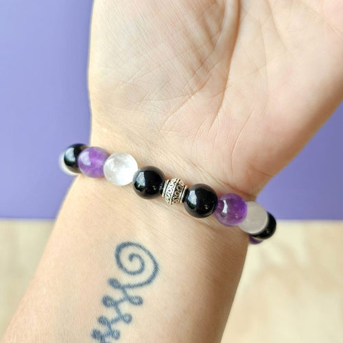Close-up of The Cleanse bracelet showing natural gemstone details and tranquil energy tones.