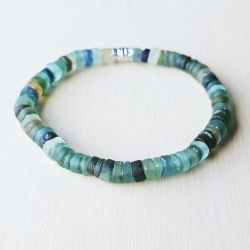 Authentic Roman Glass bracelet featuring 6 mm beads in aqua and sand hues, simple and timeless.