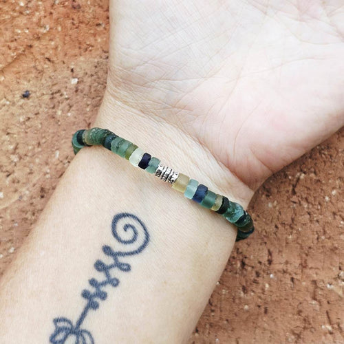 Roman Glass bracelet on arm, refined design blending modern wear with ancient origins.