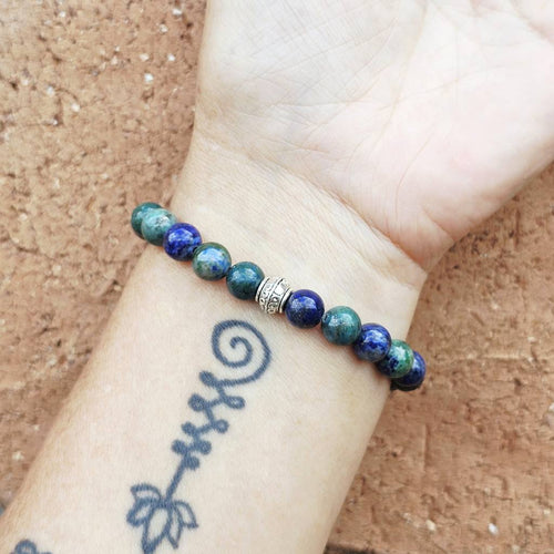Natural Azurite and Malachite crystal bracelet on arm, luxury gemstone jewellery with earth energy.