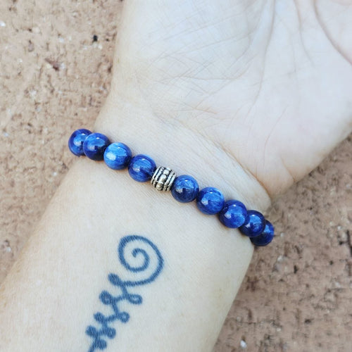 Blue Kyanite bracelet on arm, natural stone design promoting clarity and calm energy.