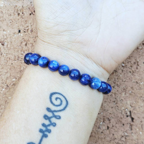 Blue Kyanite crystal bracelet on wrist, handmade jewellery for men and women seeking focus and flow.