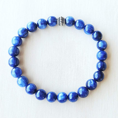 Close-up of Blue Kyanite natural stone bracelet showing polished 8 mm blue beads.