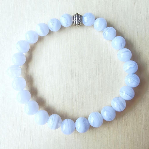 Close-up of Blue Lace Agate bracelet showing natural 8 mm stone beads with soft blue bands.