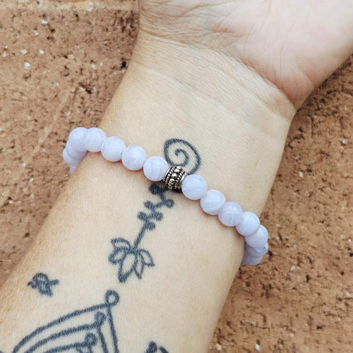 Blue Lace Agate crystal bracelet on arm, natural stone design for clarity and flow.
