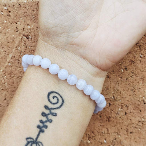 Blue Lace Agate bracelet on wrist, handmade jewellery for men and women seeking calm and focus.