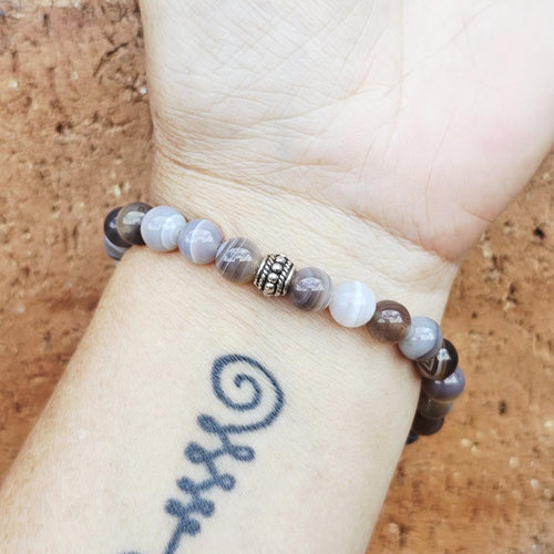 Botswana Agate beaded bracelet worn on wrist – emotional balance crystal