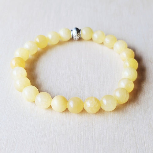 Orange Calcite bracelet for men and women, radiating joy and confidence.