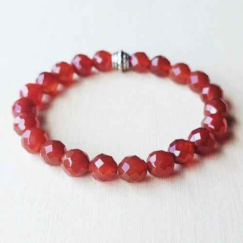 Carnelian crystal bracelet close-up, handmade design for men and women.