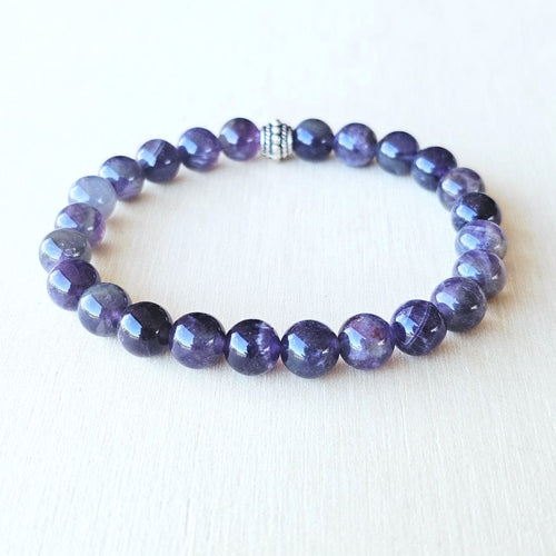 Dual crystal bracelet harmonising intuition and strength.