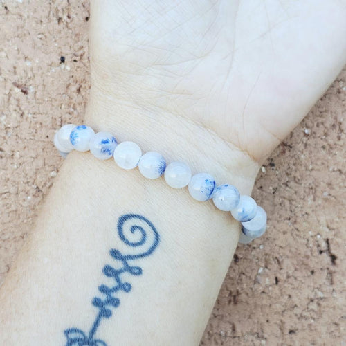 Blue Dumortierite stone bracelet on wrist promoting calm focus and communication.