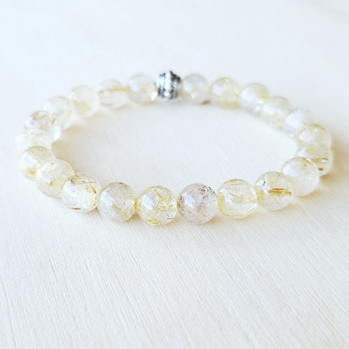 Golden Rutilated Quartz bracelet amplifying light and spiritual awareness.