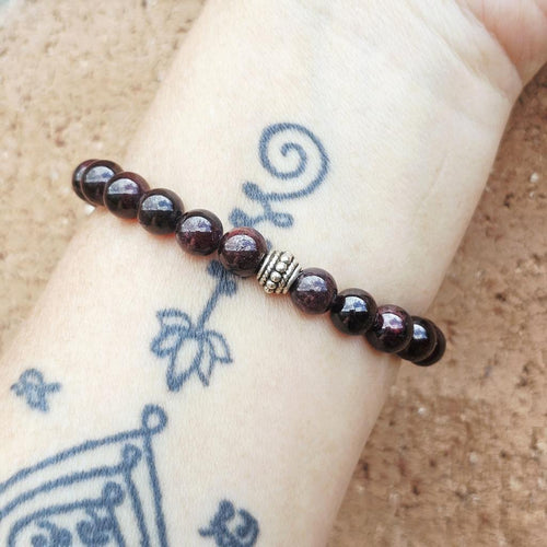 Grounding Garnet crystal bracelet promoting courage and confidence.