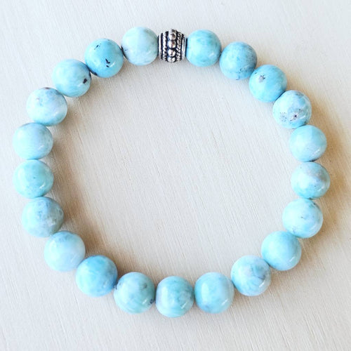 Ocean-blue Larimar beaded bracelet symbolising peace, clarity, and fluidity.