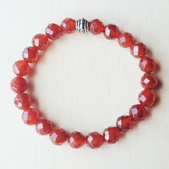 Natural Carnelian beaded bracelet with faceted stones symbolising vitality and courage.
