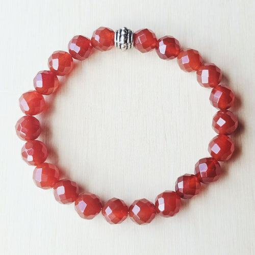 Natural Carnelian beaded bracelet with faceted stones symbolising vitality and courage.