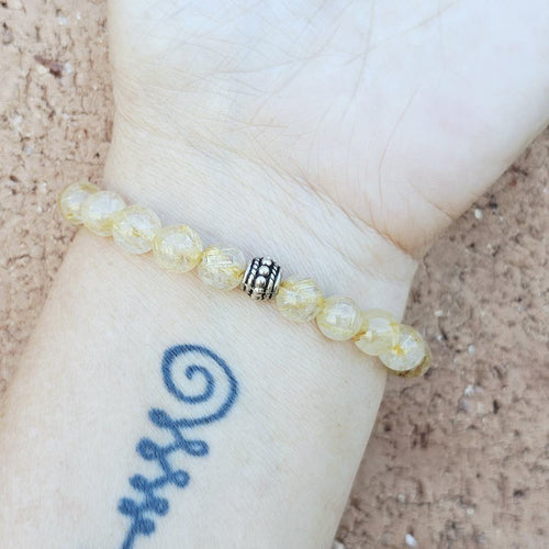 Natural gemstone beaded bracelet radiating energy and divine connection.