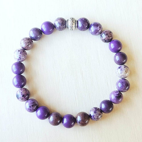 Natural lilac gemstone bracelet promoting calm and spiritual balance.