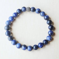 Blue gemstone bracelet activating the Throat and Third Eye Chakras.
