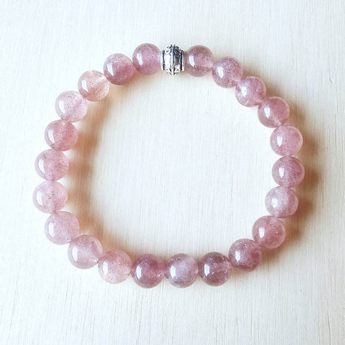 Pink gemstone bracelet opening Heart Chakra for compassion and trust.