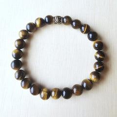 Natural Tiger’s Eye gemstone bracelet for solar plexus chakra empowerment.