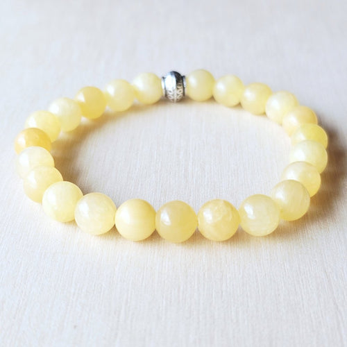 Handmade Orange Calcite crystal bracelet for vitality and creative energy.