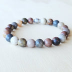 Handmade Petrified Wood crystal bracelet for grounding and transformation.