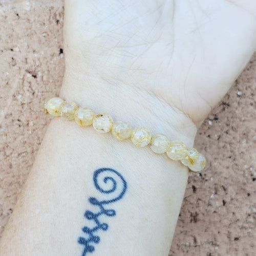 Handmade Rutilated Quartz crystal bracelet for clarity and grounding.