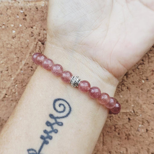 Natural Strawberry Quartz gemstone bracelet radiating grace and peace.