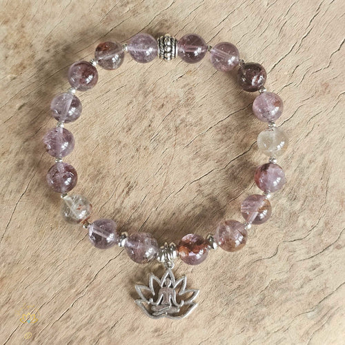 Manifestation tool Super 7 gemstone bracelet 8mm for intention setting and energy flow.