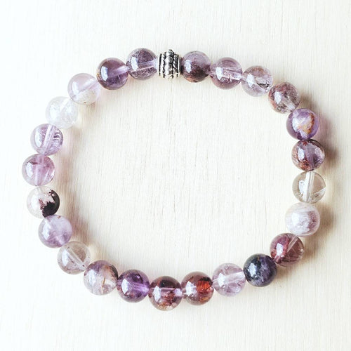 Super 7 bracelet 8mm beads designed for channeling knowledge and universal connection.