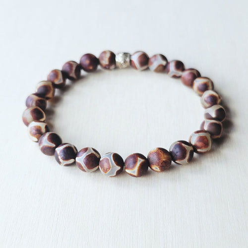 Earthy 8mm Agate bracelet for balance, resilience, and inner peace.